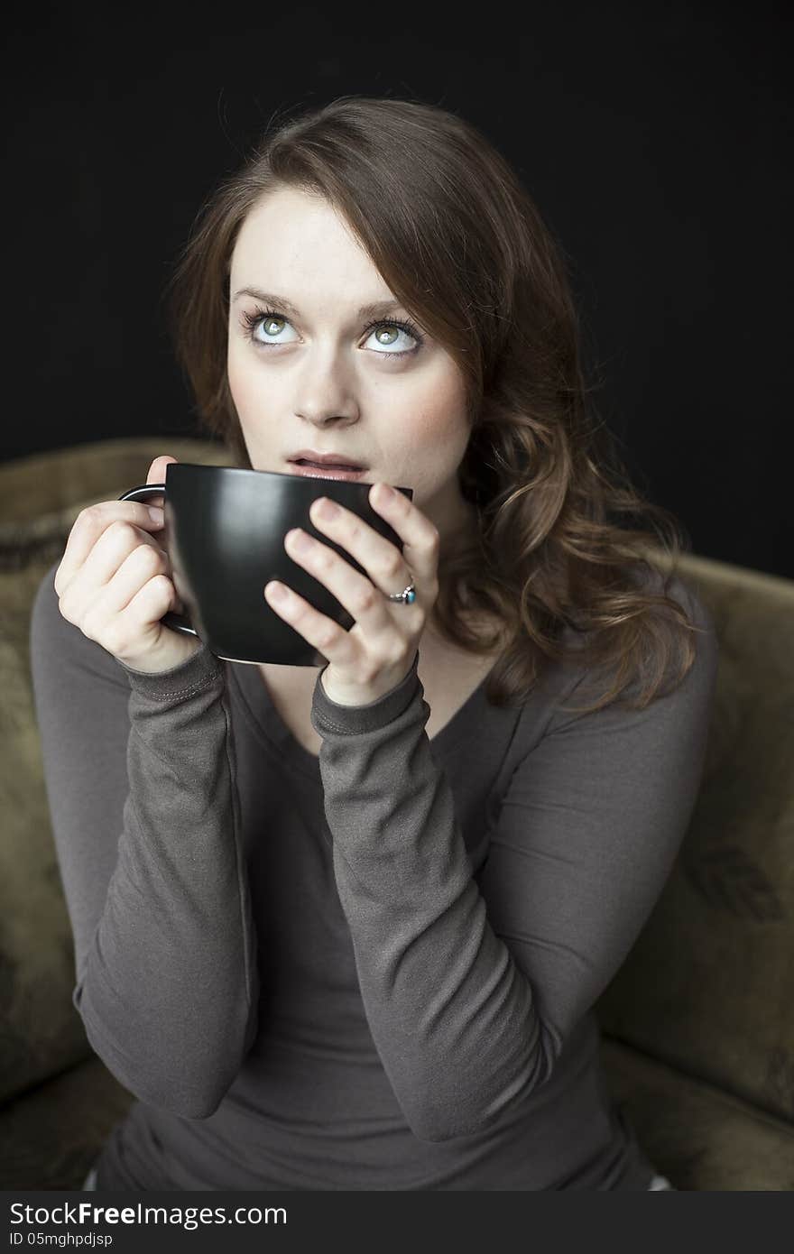 Young Woman With Black Coffee Cup