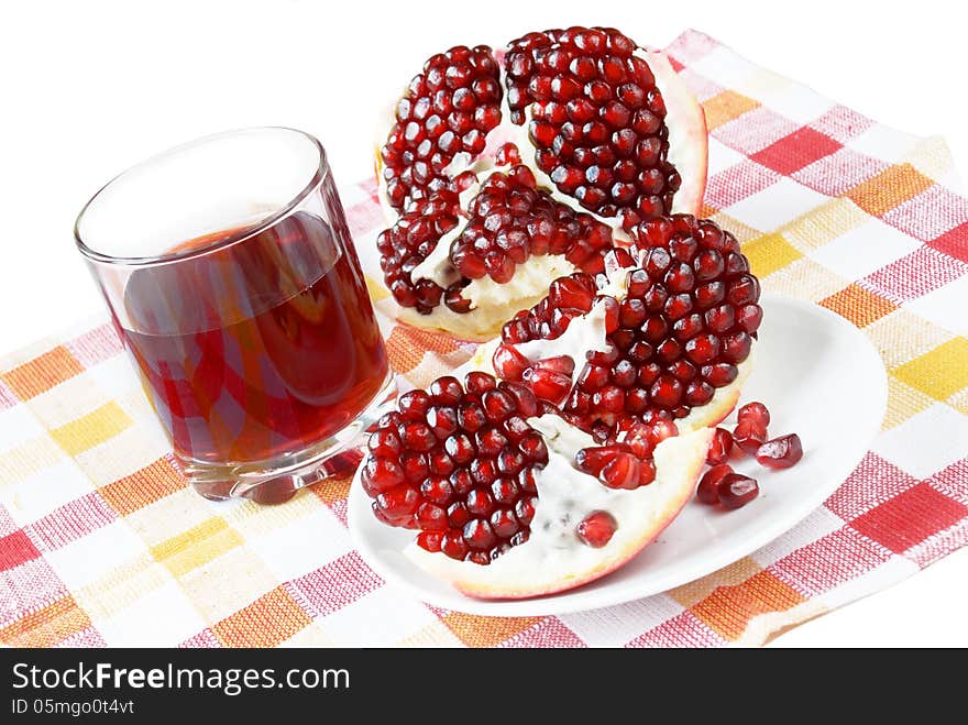 Pomegranate juice in a glass and a pomegranate