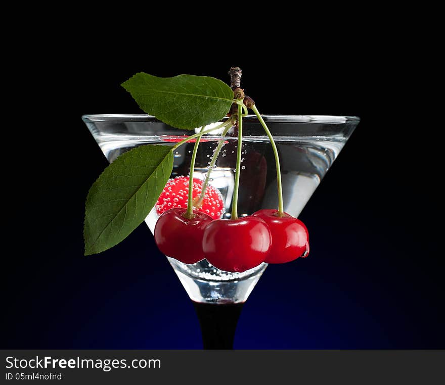 Cherries in a martini glass. Clipping path