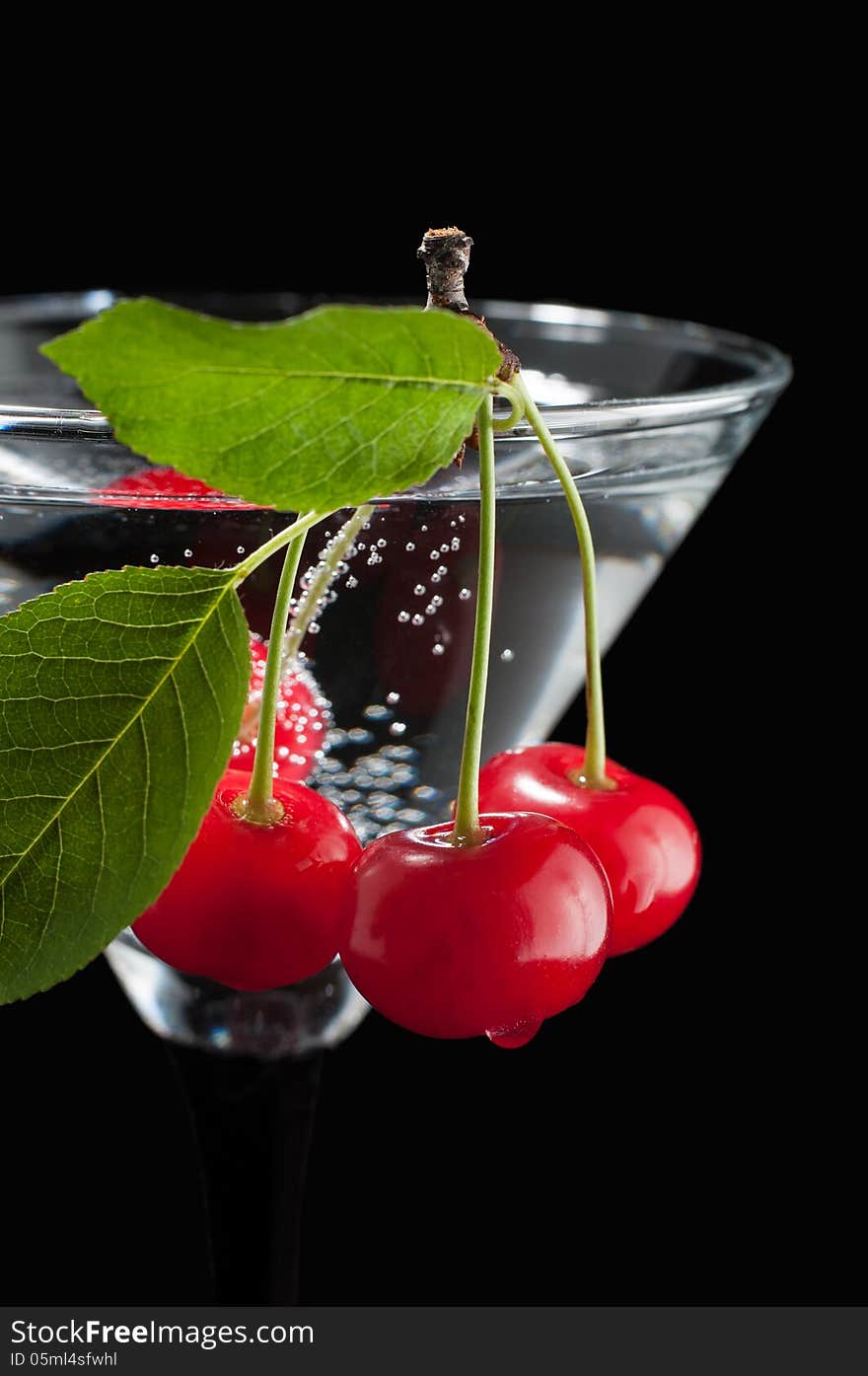 Cherries in a martini glass.