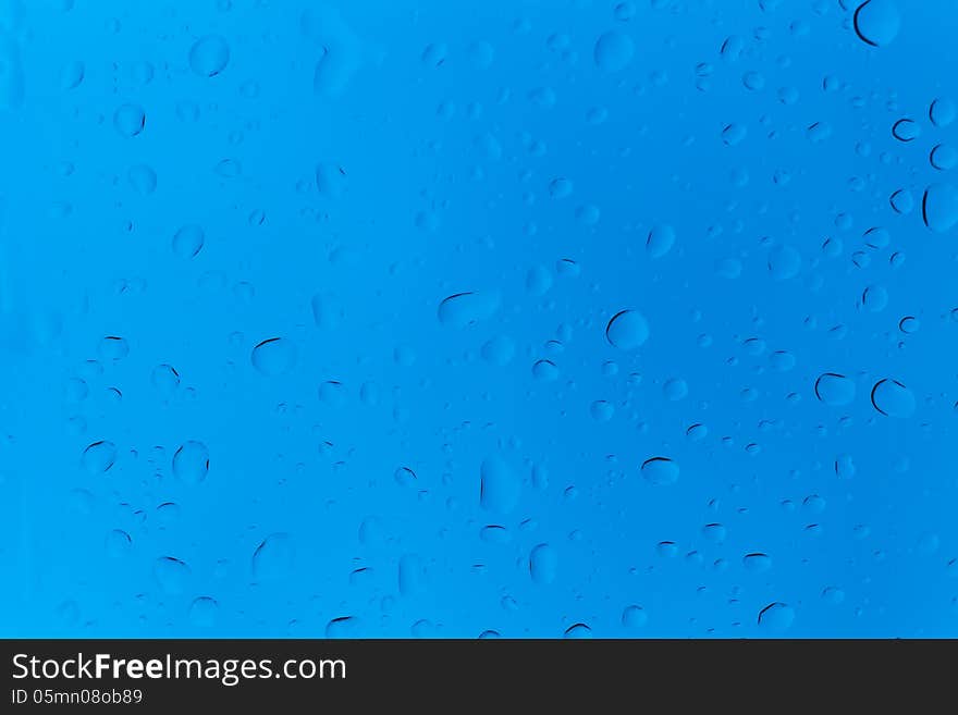 Rain water drop on blue tint color glass. Rain water drop on blue tint color glass