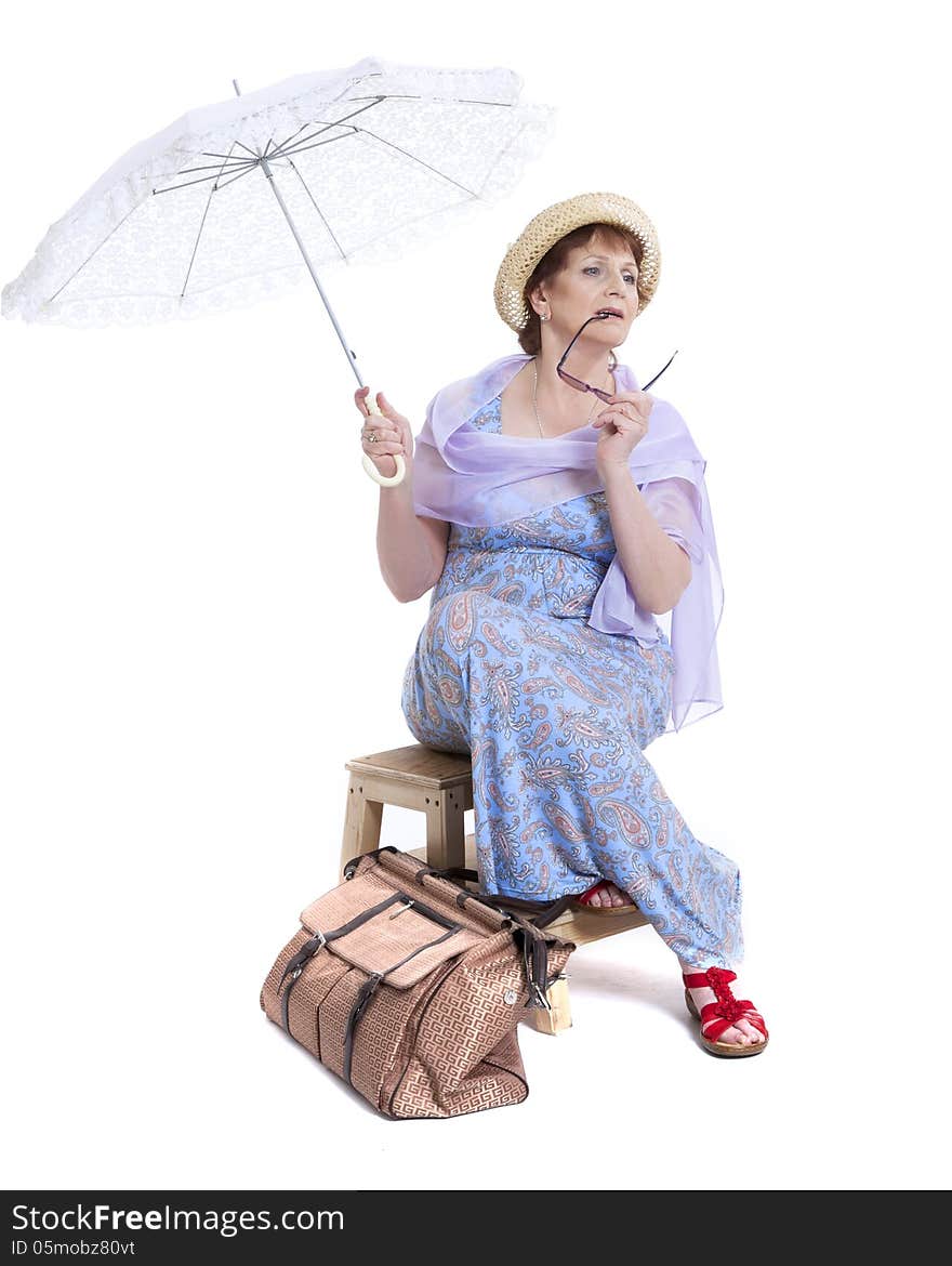 Beautiful woman with basket of flowers holding umbrella. Beautiful woman with basket of flowers holding umbrella