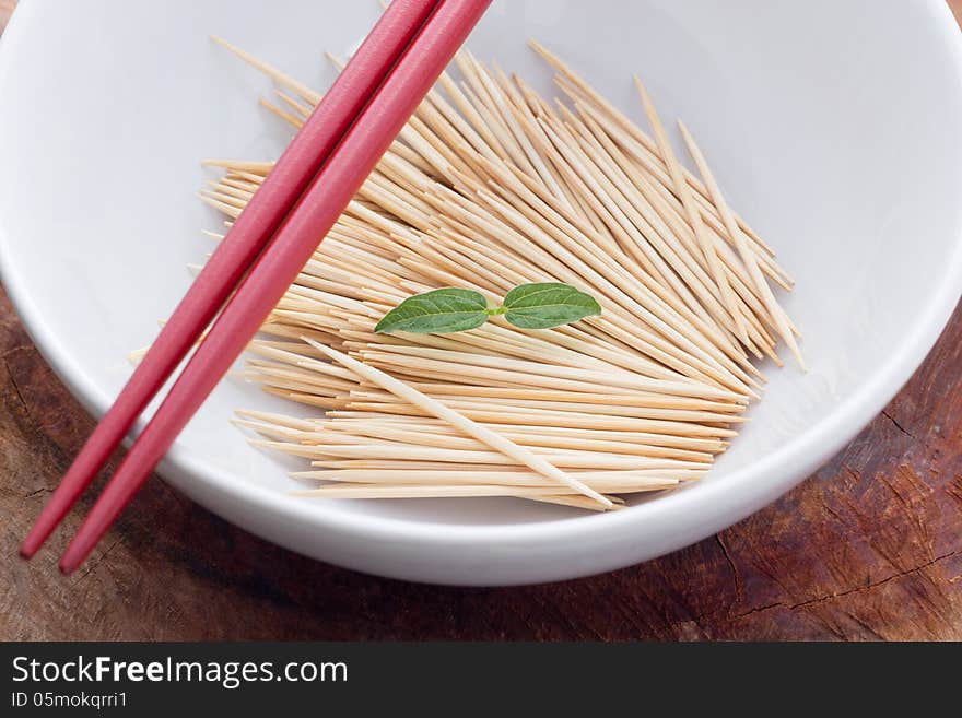 Bamboo skewers in plate on table closeup. Bamboo skewers in plate on table closeup