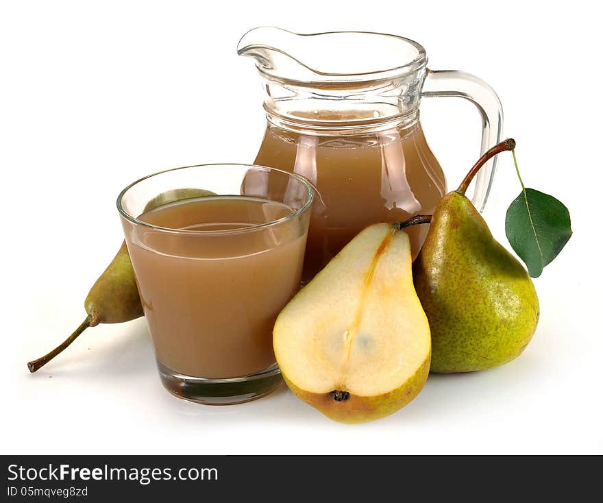 Pear juice in a jug and a glass of fruit. Pear juice in a jug and a glass of fruit