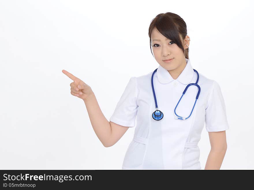 Young asian female nurse rise hand showing blank sign. Young asian female nurse rise hand showing blank sign