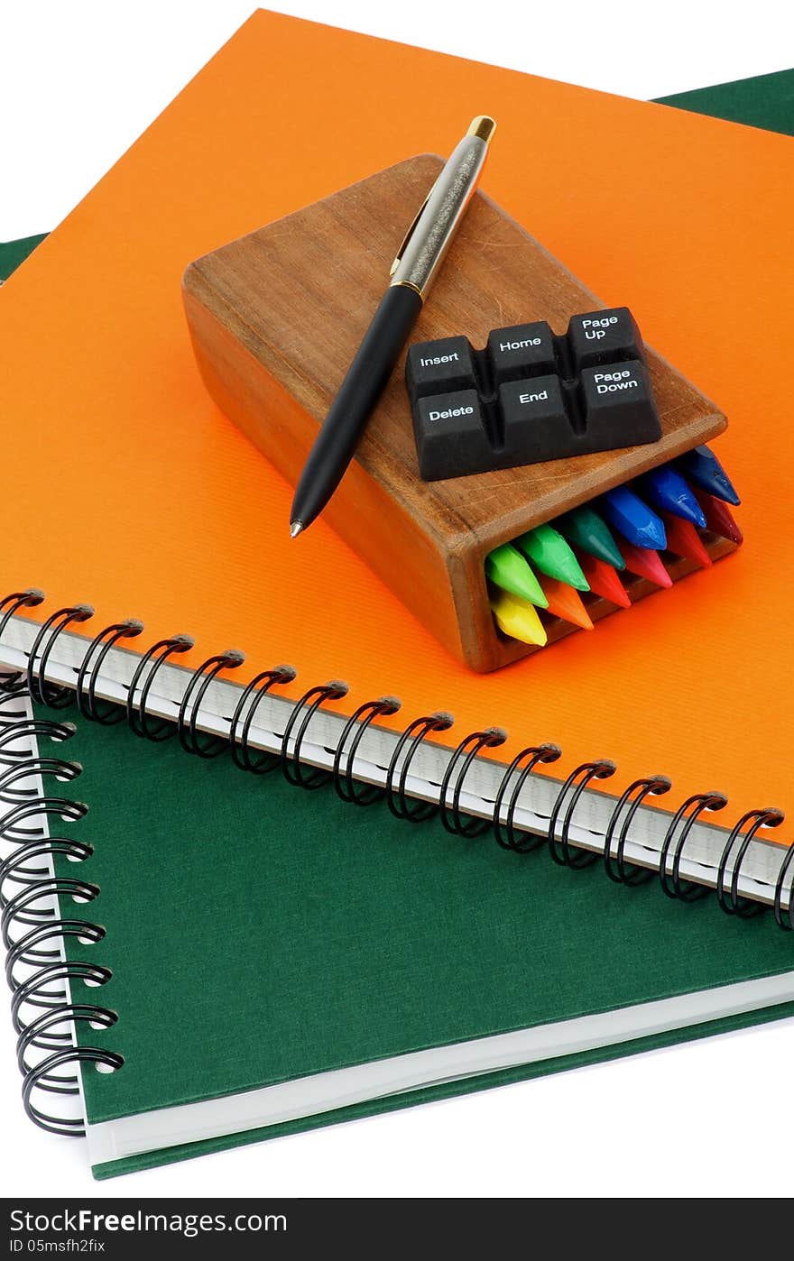 Arrangement of Spiral Notebooks, Pen and Keyboard Buttons closeup. Arrangement of Spiral Notebooks, Pen and Keyboard Buttons closeup