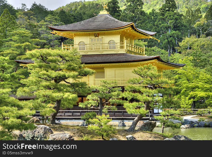 Kinkaku-ji Temple of the Golden Pavilion (also known as Rokuon-ji) is a Zen Buddhist temple in Kyoto in Japan. Kinkaku-ji Temple of the Golden Pavilion (also known as Rokuon-ji) is a Zen Buddhist temple in Kyoto in Japan.