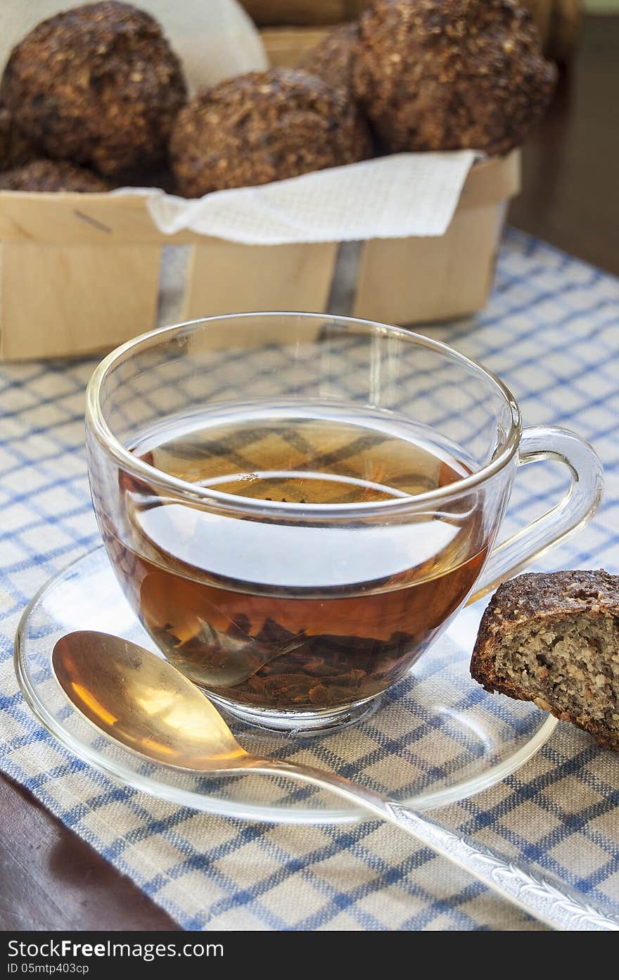 Glass cup of tea on an old table