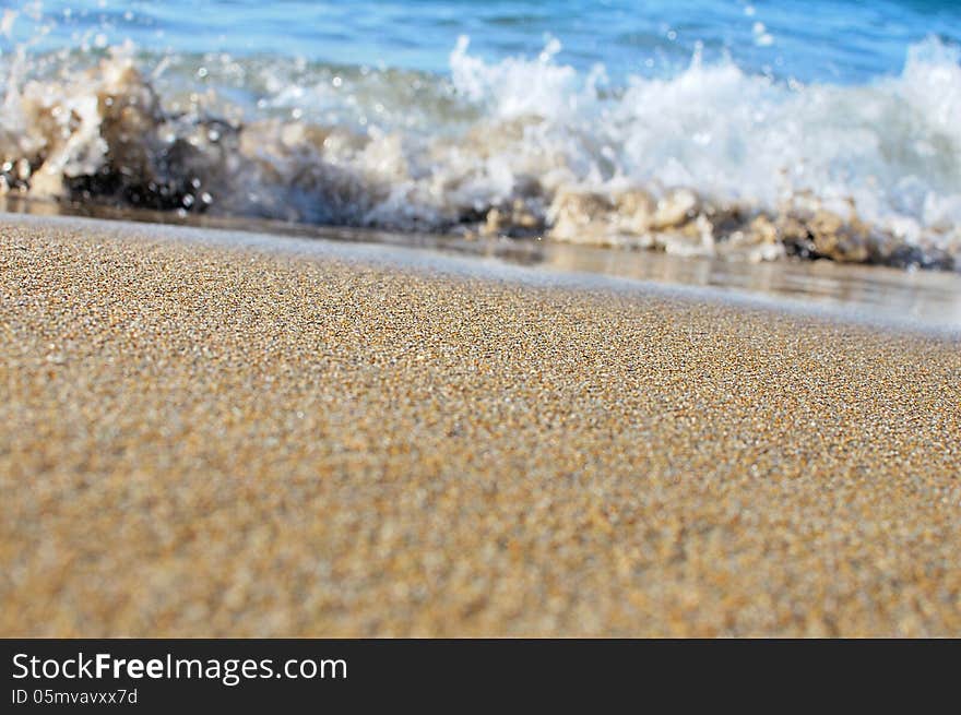 Wave splashing on a beautiful sandy beach in Hersonissos,Crete, Greece !