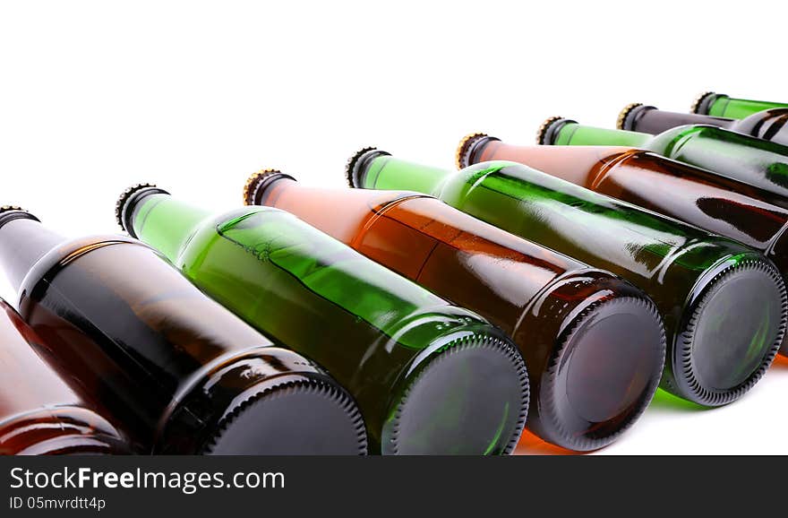 Different bottles of beer are located on the white background.