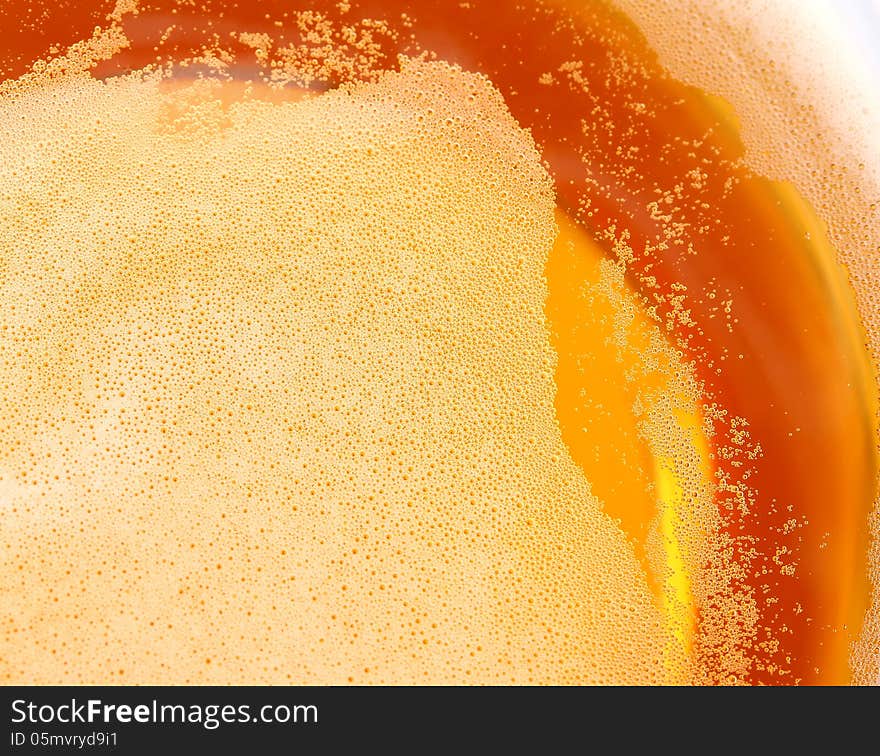 Glass of beer, top view close-up.