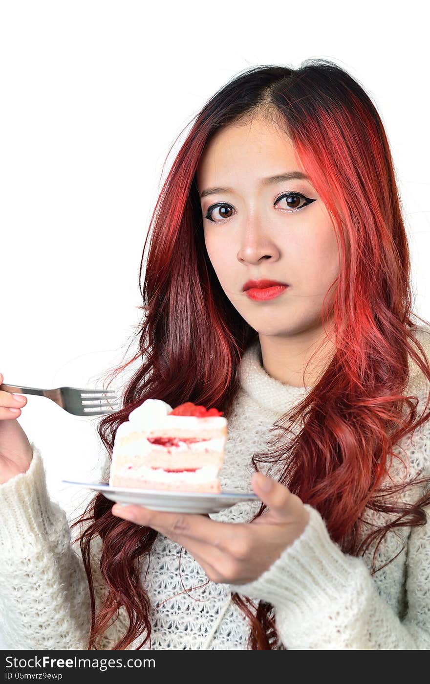 Close up beautiful asian woman with red long hair eating cake. Close up beautiful asian woman with red long hair eating cake