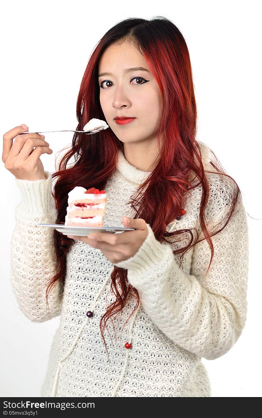 Close up beautiful asian woman with red long hair eating cake. Close up beautiful asian woman with red long hair eating cake