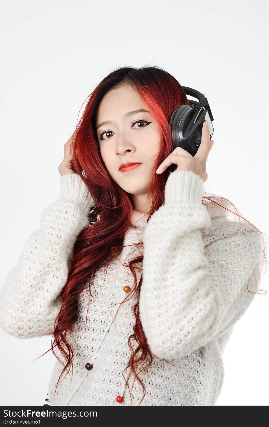 Asian woman with red color long hair listening. Asian woman with red color long hair listening