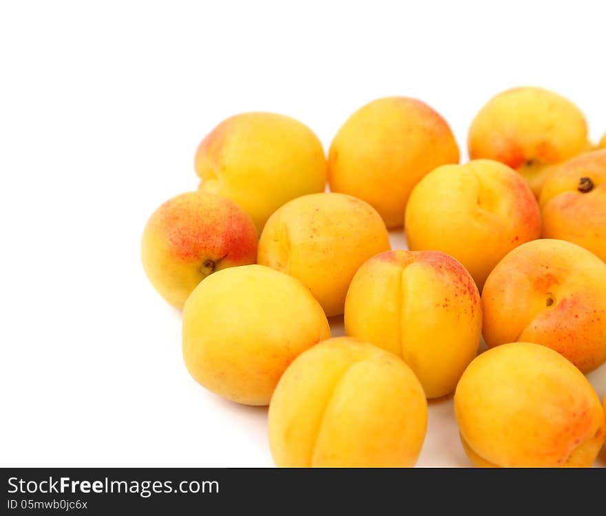 A lot of fresh apricots isolated on a white background