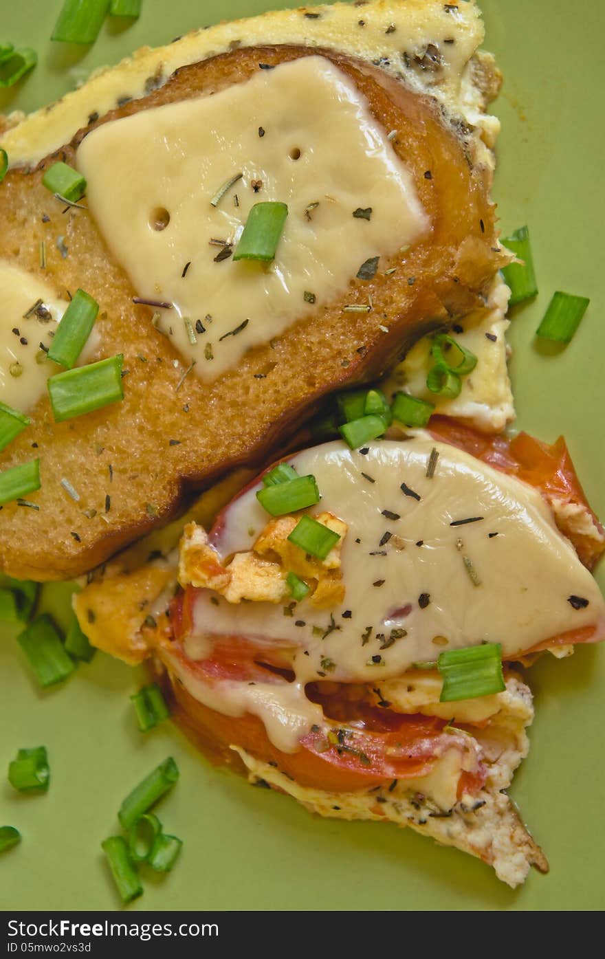 Scrambled Eggs With Tomato And Toast With Cheese