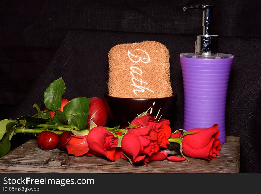 Spa stones, fruit and roses on black background. Spa stones, fruit and roses on black background