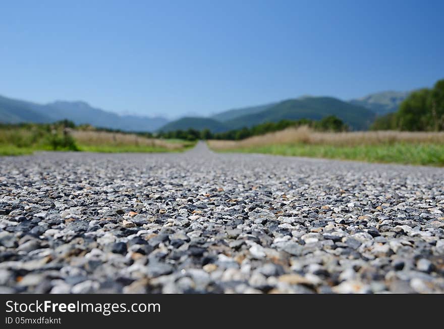 The road surface is photographed close-up with diminishing perspective. The road surface is photographed close-up with diminishing perspective.