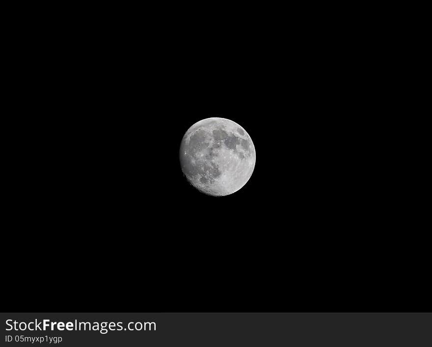 A view of a almost full moon