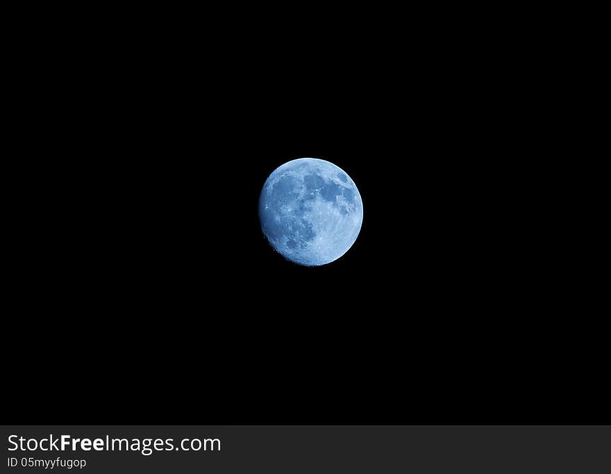 A view of a almost full moon. A view of a almost full moon