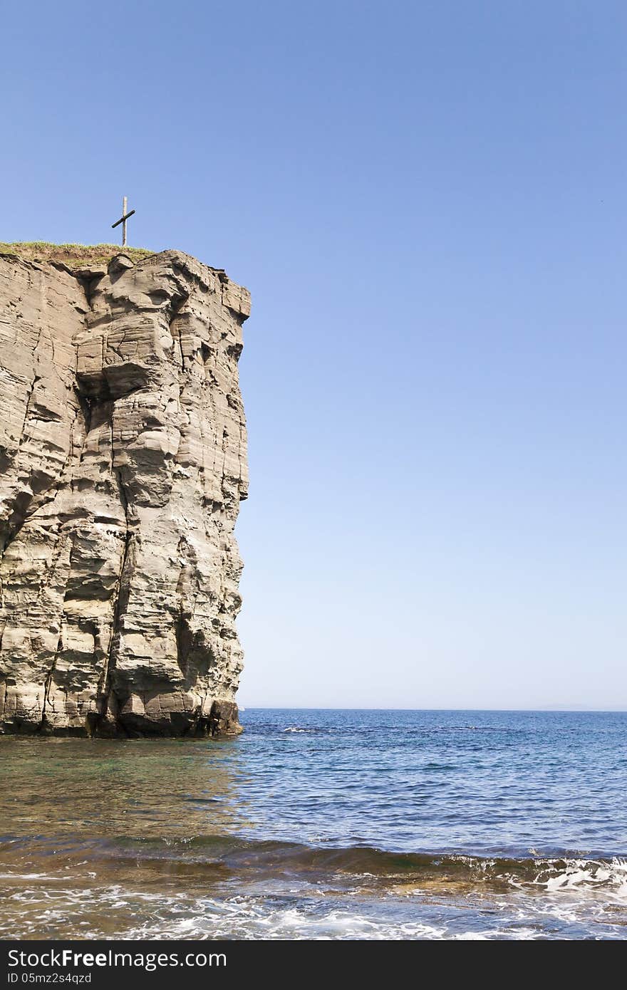 The sea and rocks under beams of a bright sun