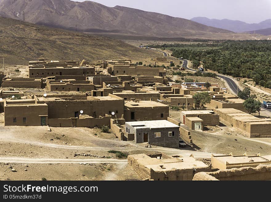 The way from Quarzazate to Zagora , over the mountains from the High Atlas in Morocco. Houses from a kasbah. The way from Quarzazate to Zagora , over the mountains from the High Atlas in Morocco. Houses from a kasbah.