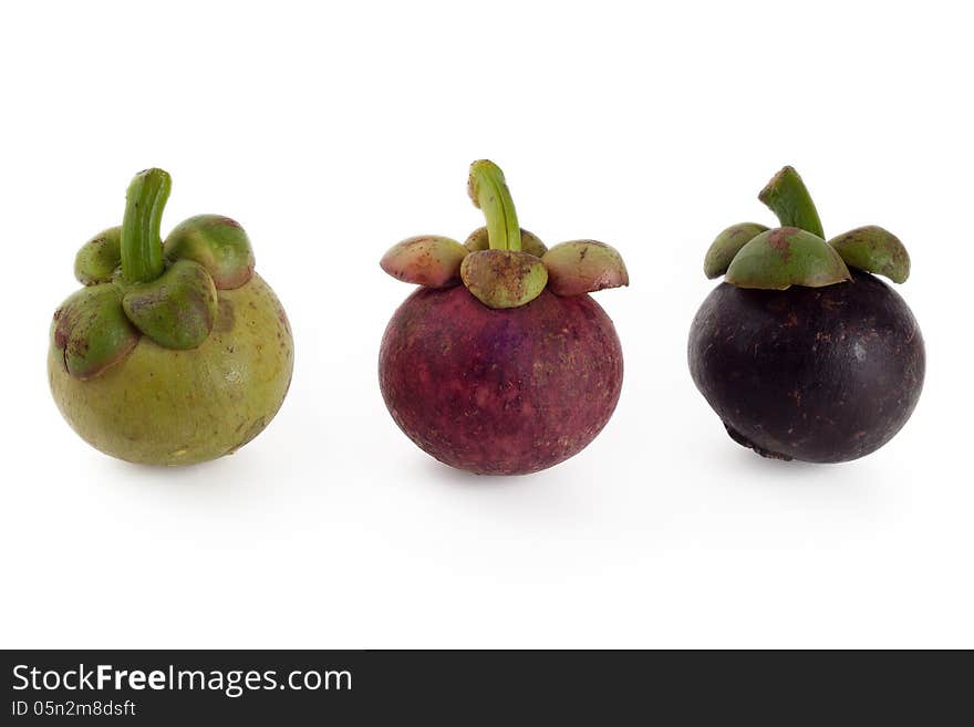 Mangosteen in three stages of ageing, green red and violet