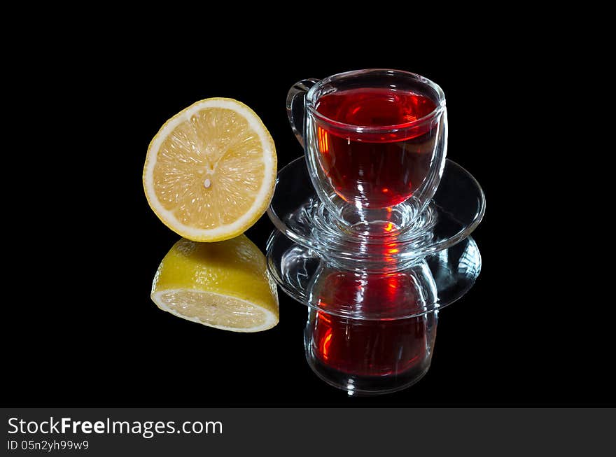 Red Tea And Lemon With Reflection