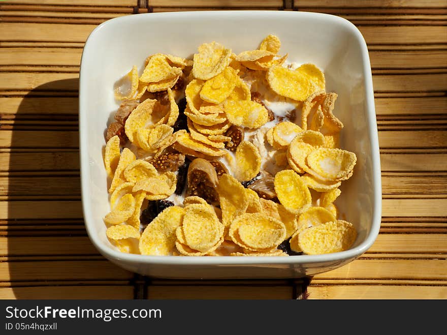 Bowl Of Oatmeal With Cereal, Prunes And Milk