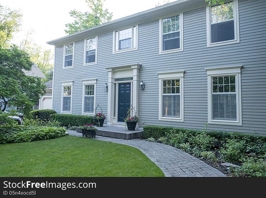 Blue house with neat garden. Blue house with neat garden.