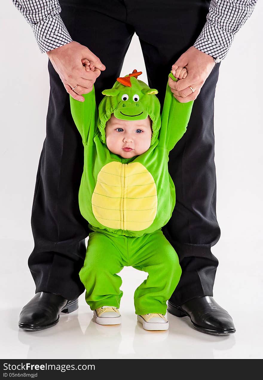 The small child in a suit of a dragon