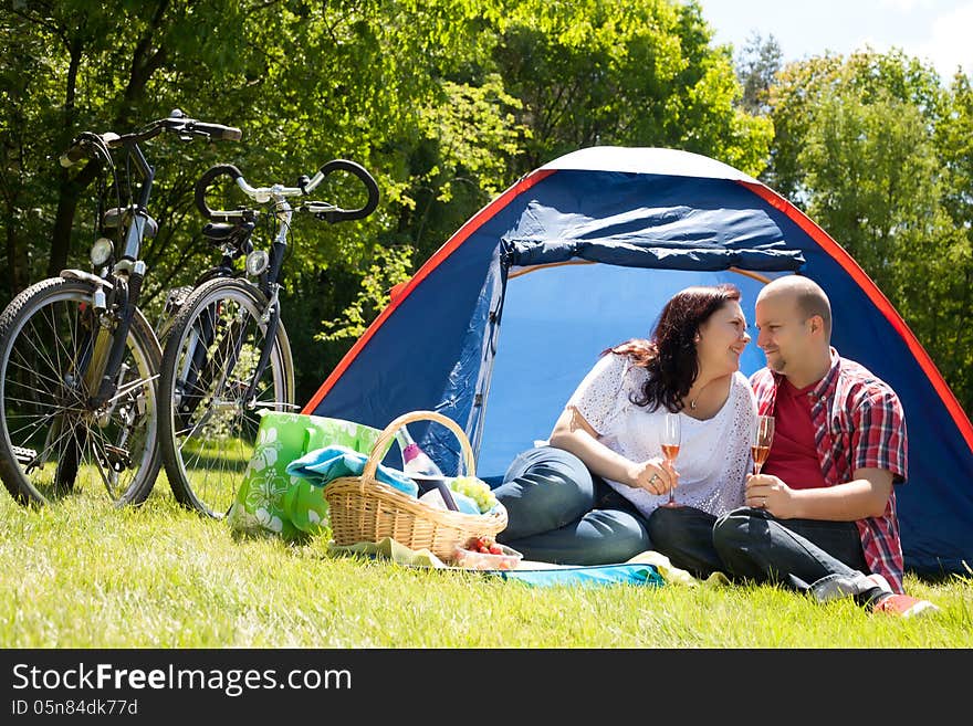 Happy Couple On A Camping Drinking Prosecco