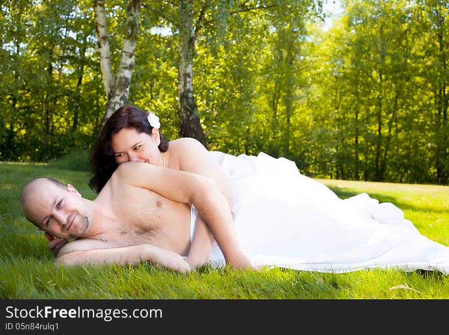 Happy young couple dressed white in the nature. Happy young couple dressed white in the nature