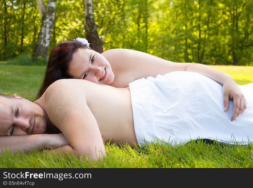 Happy young couple dressed white in the nature. Happy young couple dressed white in the nature