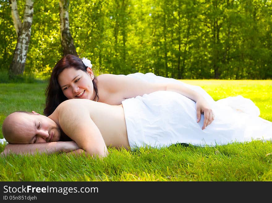 Happy young couple dressed white in the nature. Happy young couple dressed white in the nature