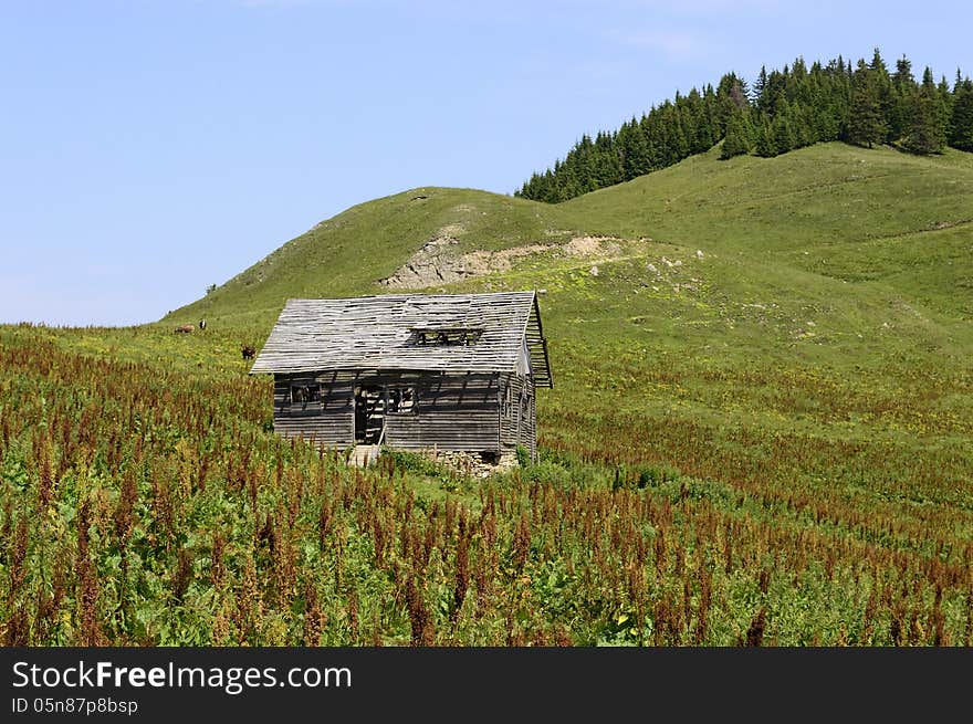 Wooden old abandoned house in the foothills