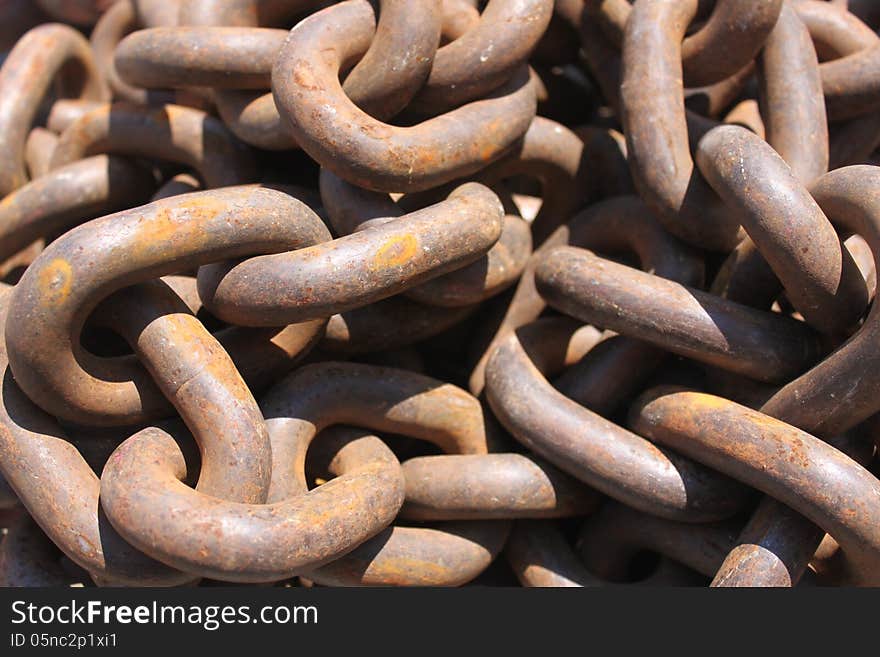 Macro rusty brown links of chain. Macro rusty brown links of chain