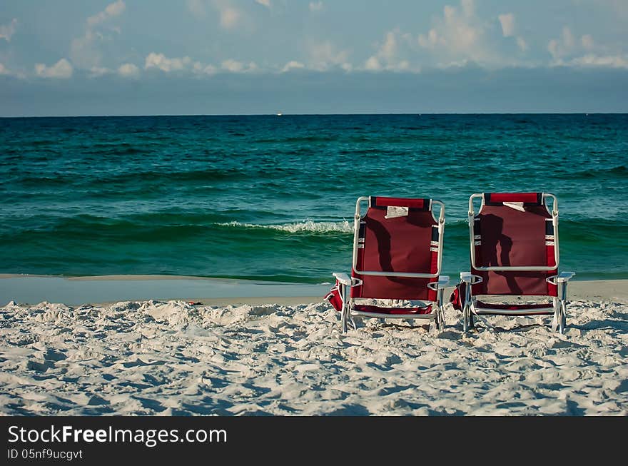 Two chairs on a beach