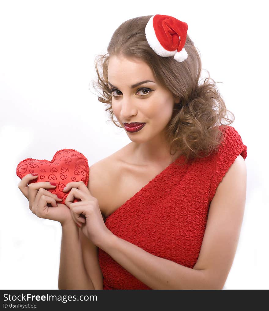 Pretty sexy woman in santas red hat isolated