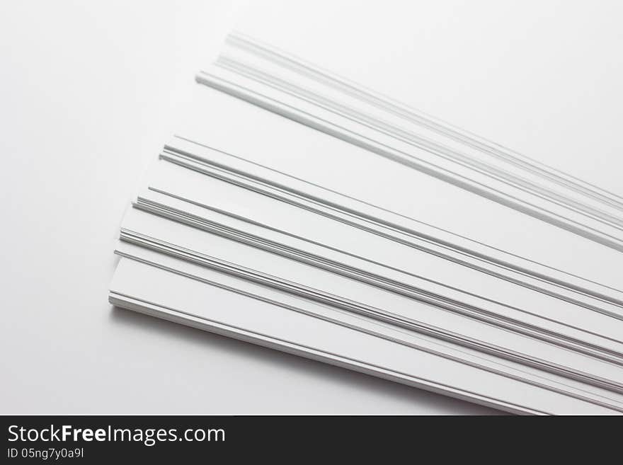 Close up of stack of papers on white background