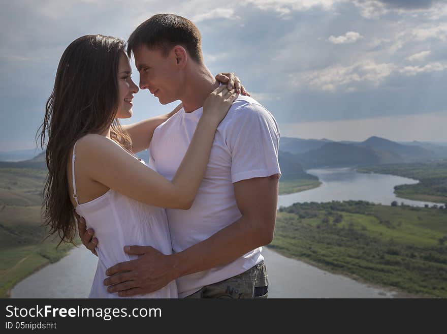 Young Couple hugging in mountains