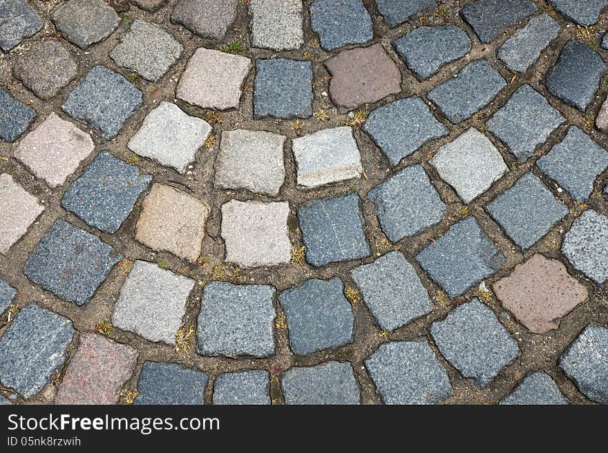 The old multicolored brick floor. The old multicolored brick floor