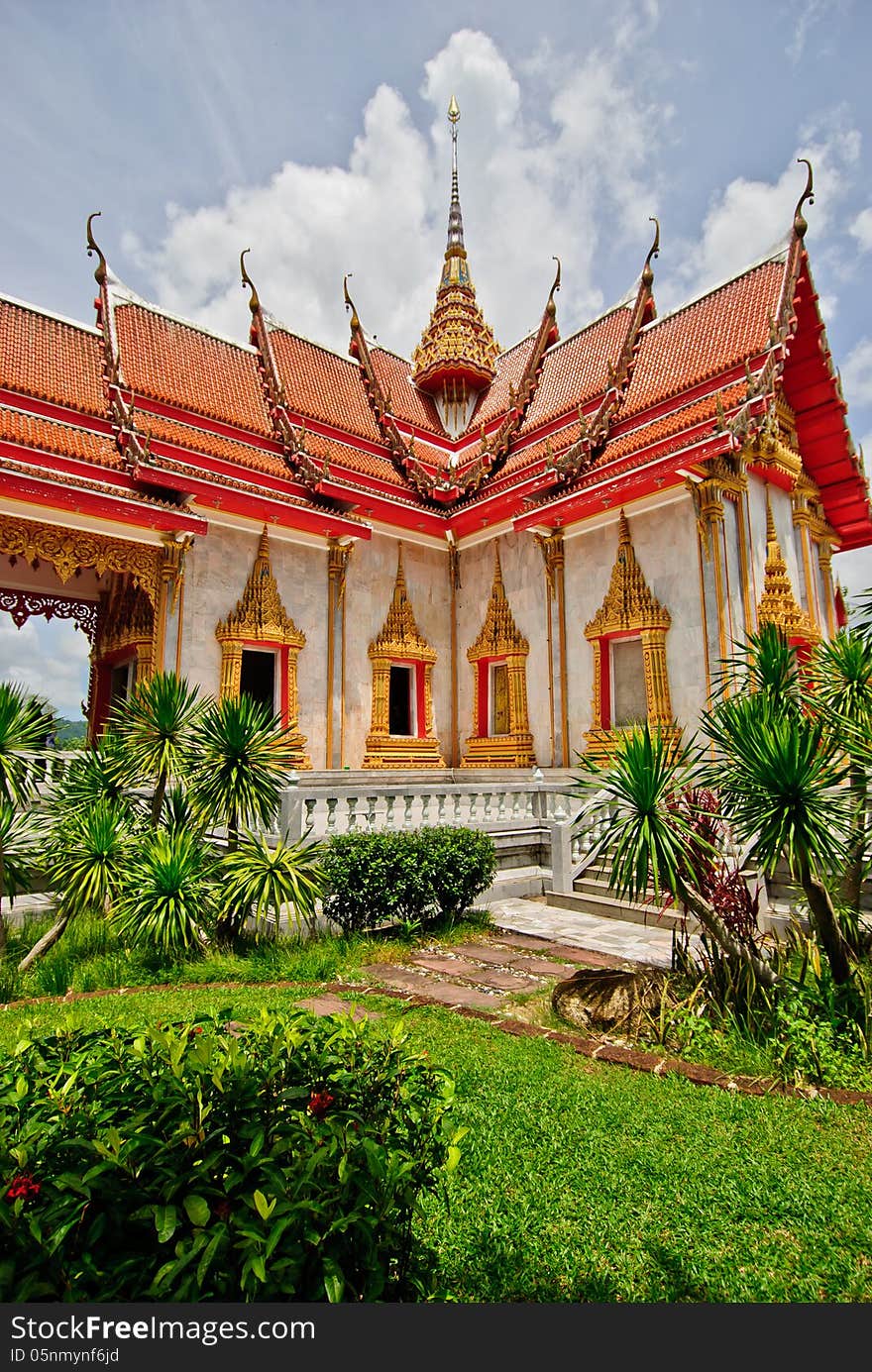 The Ubosot Sanctuary Hall with its steeply pitched, gabled roofs, chofah ornaments, and gilded spire. The Ubosot Sanctuary Hall with its steeply pitched, gabled roofs, chofah ornaments, and gilded spire.