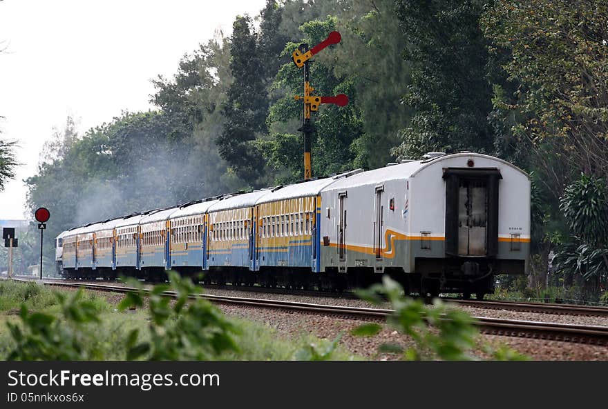 Train crossing rail lines in the city of Solo, Central Java, Indonesia