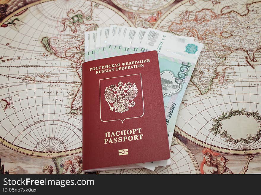 Passport and money . background of the map of the world