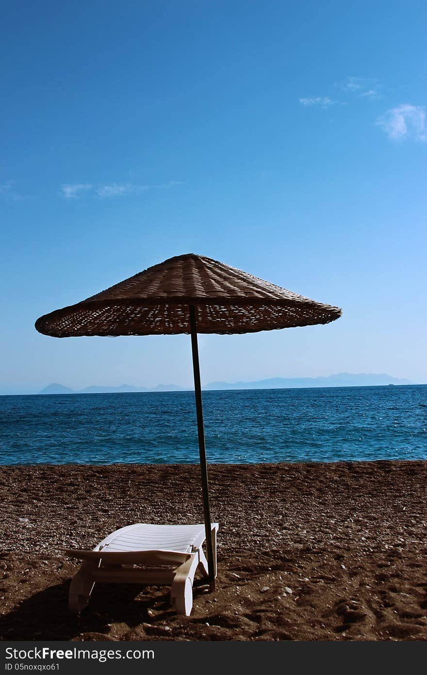 Sunbed and umbrella in Datca Palamutbuku Beach. Sunbed and umbrella in Datca Palamutbuku Beach