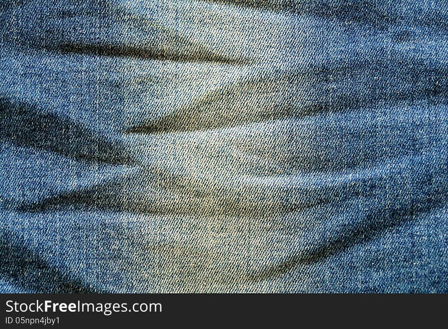 Blue jeans fabric with creased texture. Blue jeans fabric with creased texture