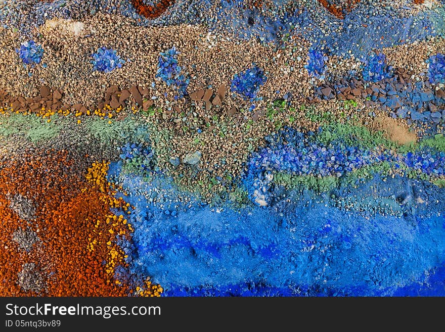 Close up on an abstract background composition made by multicolored sand. Close up on an abstract background composition made by multicolored sand