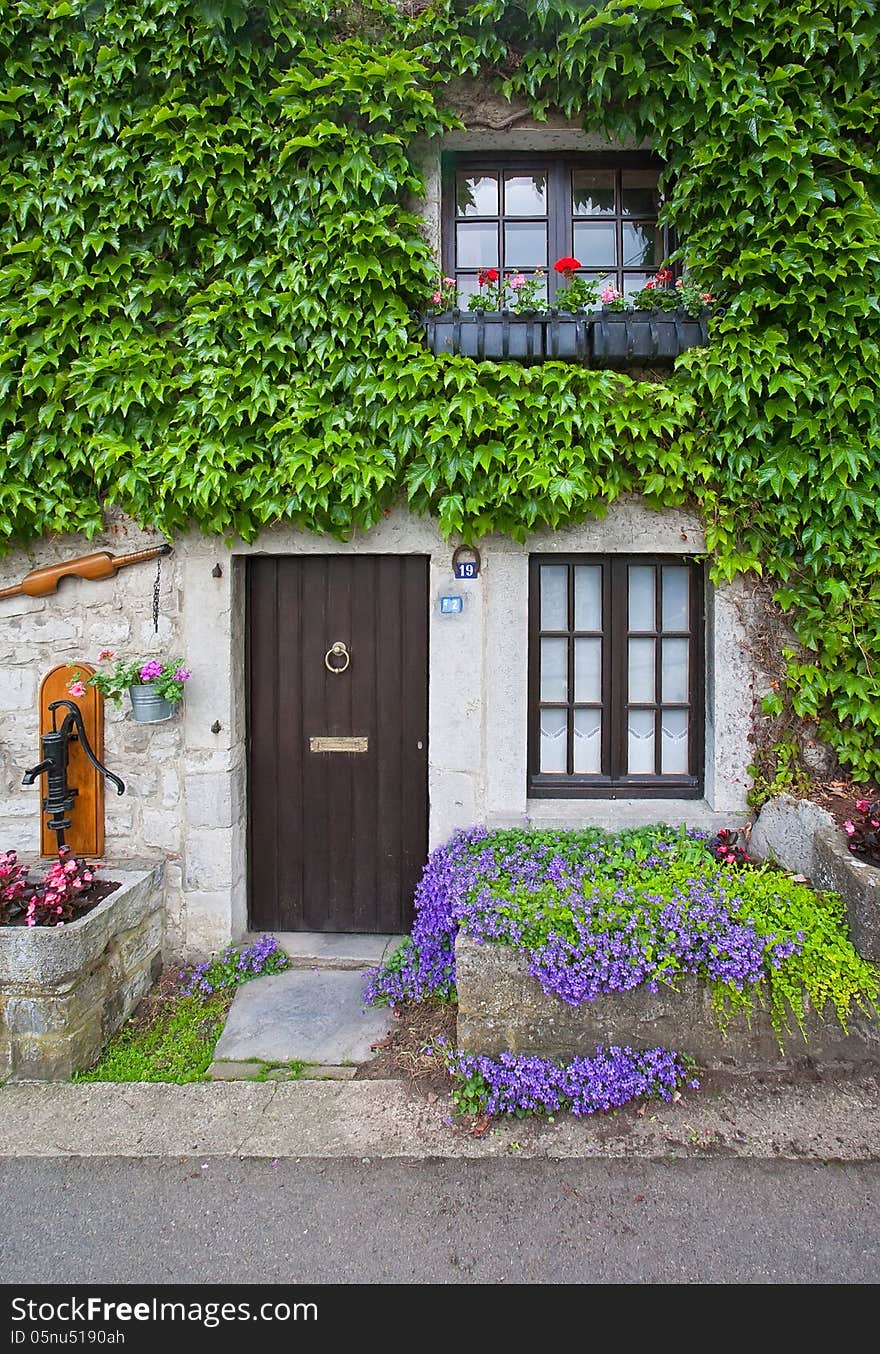 Traditional old porch with flowers and ivy. Belgium. Traditional old porch with flowers and ivy. Belgium