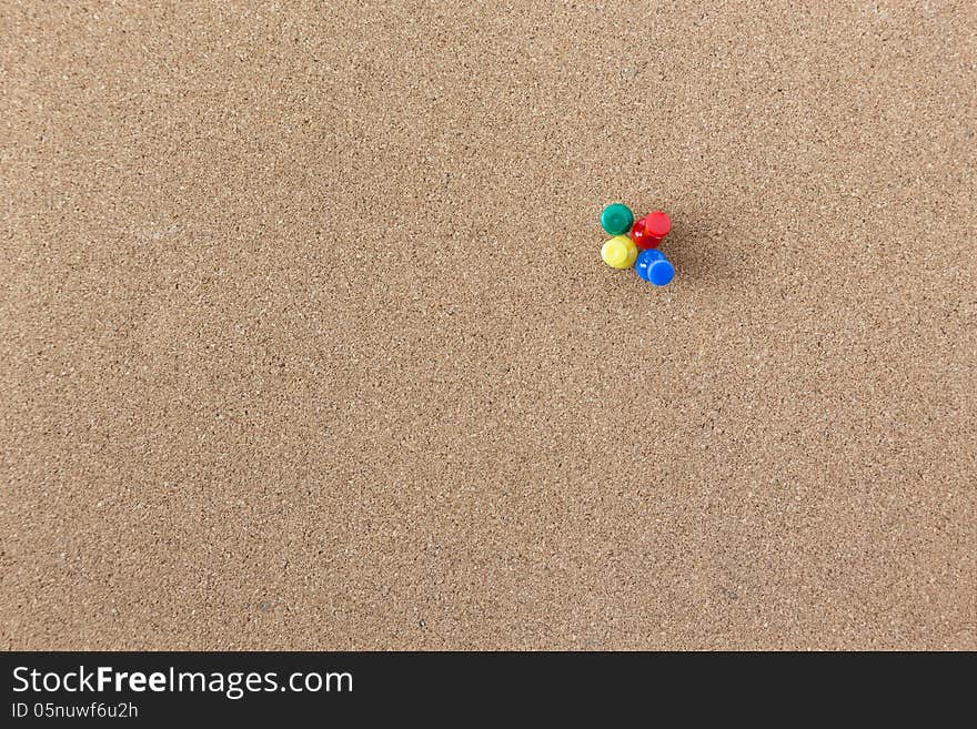 Colourful Pushpin On Cork Board